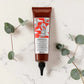 Tube de 150 ml du Naturaltech Energizing Gel de Davines, gel anti-chute pour cuir chevelu et cheveux fragiles au Hair Energy Complex et aux phytoceutiques de caféine, posé à plat sur un plan en marbre entouré de feuilles d'eucalyptus.