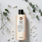 Shampoing Maria Nila Head & Hair Heal sur fond blanc avec eucalyptus et galets blancs, Victor Bazin Paris